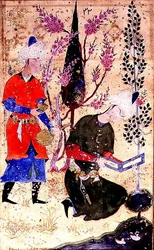 A seated prince reading whilst a servant serves wine, from the Tohfat Al-Ahrar, Bokhara School