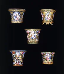 A selection of Qajar enameled gold nargileh bowls, painted with single or double portrait panels, 19th century