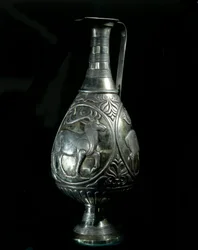 Persian art: silver decanter decorated with medallions representing deer. 5th-7th century. Private Collection