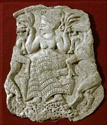 Phoenician Art: Carved Ivory Pyxide Cover Representing a Mycenaean Fertility Goddess Nourishing Goats