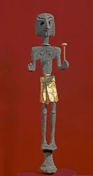 Phoenician art: statuette of a deity in silver and gold. 20th or 19th century BC. From Ras Shamra (Ugarit). Height 28 cm. National Museum of Aleppo, Syria