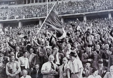 Italian fans supporting their athletes in the stadium at the Olympic Games, Berlin, Germany