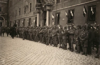Album "The Royal Army (World War I)": military troops in a street in the city of Ravenna festively decorated with the tricolor on the windows