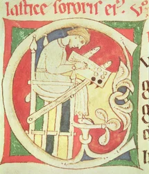 Historiated initial C depicting a monk writing, from Vitae Sanctorum, Santa Cruz de Coimbra