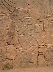 Figure of a warrior wearing a helmet and holding a club