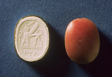 Seal inscribed in Hebrew script for a lady called Hannah and a sphinx with a modern impression of the design, found at Tell ed-duwair (Lachish) Israel