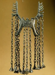 Elk shaped pendant with two heads from a site in Dolanlar. Bronze Age. Azerbaijan State Religion History Museum, Baku