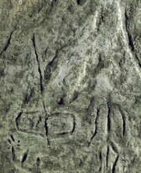 Petroglyph (graffiti on stone) of a representation of a boat and a human figure. Neolithic, Stone Age. Bronze age. Azerbaijan State Religion History Museum, Baku