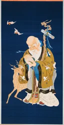 A large kesi hanging scroll depicting Shoulao holding a peach, embracing a rootwood staff with a dragon head beside a deer and two bats in flight, 1796-1820