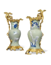 A pair of Louis XV ewers, porcelain 1662-1722, mounts c.1745-49
