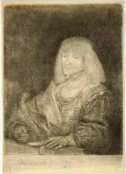 Man at a Desk Wearing a Cross and Chain