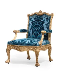 One of a pair of George III giltwood armchairs