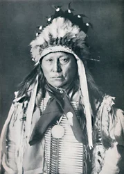 A Sioux chief in his warpaint, 1912