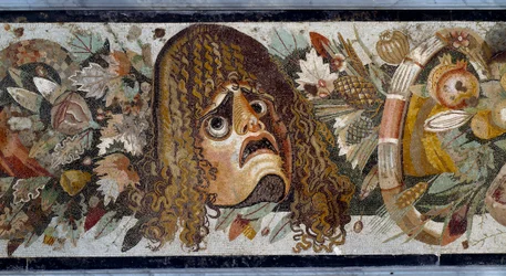 Festoon with mask, leaves and fruit. Detail. Mosaic from the House of the Faun in Pompeii, 2nd century BC. Dimensions: 280 x 49 cm. Naples, Museo Nazionale Archeologico