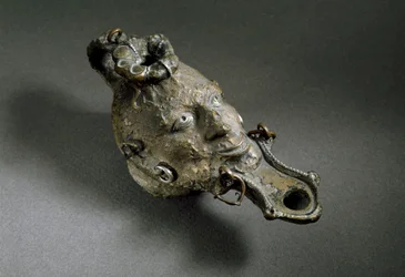 Roman Art: Bronze Oil Lamp in the Shape of a Face