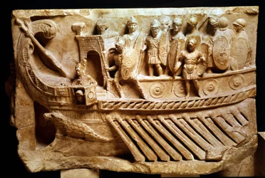 Low Roman relief depicting a bireme. A crocodile can be seen below the bow. Vatican, Vatican City, monuments, museums and pontifical galleries.