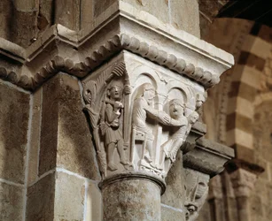 Esau returns from hunting and finds himself in front of his father Isaac who is blessing Jacob (carved capital)