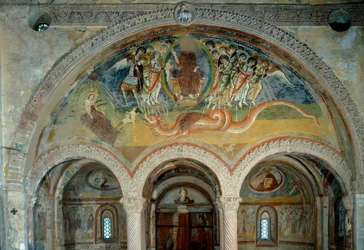 Representation of the Apocalypse: the angels pierce with their arrows the monster with seven heads