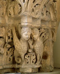 Top decorates sirens and birds on the model of those of the Church Saint Loup de Naud