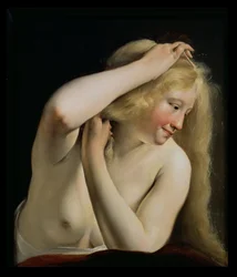 Young Woman Combing Her Hair
