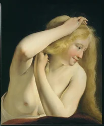 Young Woman Combing Her Hair