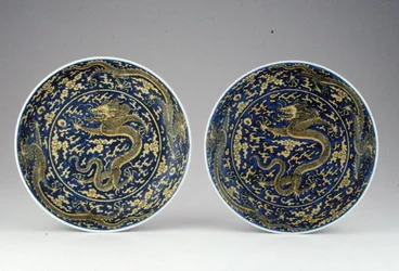 A pair of underglaze blue & yellow dragon dishes