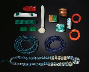 A selection of Chinese jewellery including a rare long strand of early glass beads, Warring States Period; Five strands of early glass beads from the Han Dynasty; A group of glass ornaments, all Qing Dynasty and a group of glass rings from the Qing Dynasty