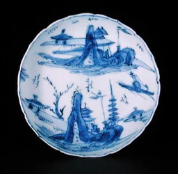 Blue and white saucer dish painted with a fisherman in a boat, Wanli or Tianqi