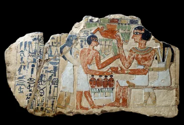 Egyptian Antiquity: Iri Stele in Limestone. A Couple Making an Offering. First Intermediate Period (2200-2033 BC). Paris, Louvre Museum