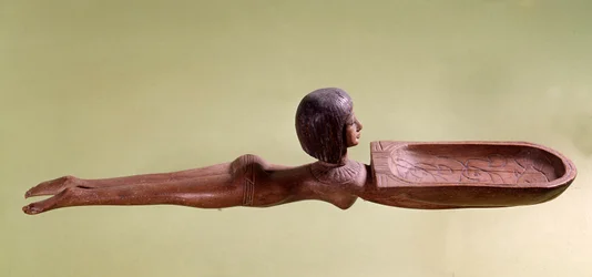 Egyptian Antiquity: Wooden Spoon for Cosmetics in the Form of a Naked Swimmer Holding a Duck. 18th Dynasty, New Kingdom. Paris, Louvre Museum