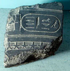 Egyptian antiquity: fragment of an Egyptian clepsydra (water clock, time measurement tool) carrying a cartridge. Ptolemaic period. Paris, Louvre Museum