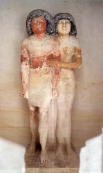 Egyptian antiquity: statue of Raherka, chief of the scribes, and his wife Meresankh. Painted limestone statue. 5th dynasty, ancient empire (around 2700-2200 BC). Dim. 0.52x0.21 m. Louvre Museum