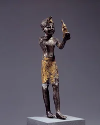 Egyptian Antiquity: Statuette of King (Sethi I?) Making the Offering of Maat. Silver and Gold Sculpture. Reign of Sethi. Louvre Museum