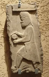 A Mede at the Royal Court of Persepolis carrying a covered vessel