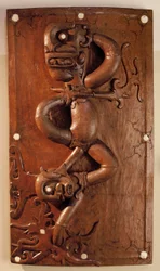 Carved door depicting the victory of the protective spirit over evil in Sarawak, Malaysia