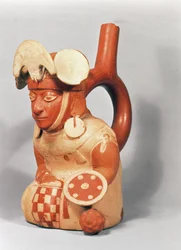 Mochican stirrup vase in the shape of a warrior