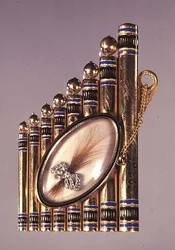 Gold pendant with enamel decoration and set with a locket containing a lock of hair in a diamond set bow (obverse), Russian, early 19th century