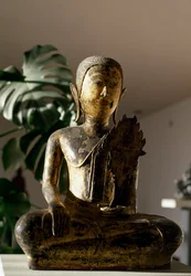 Buddha seated in Bhumisparsa Mudra gesture during meditation (sculpture)