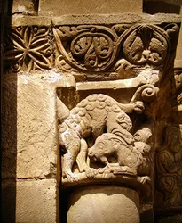 Capital Depicting a Monster Attacking a Goat