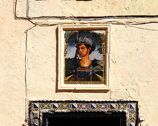 Ceramic tiles with the portrait of a man outside the House of the Moorish King