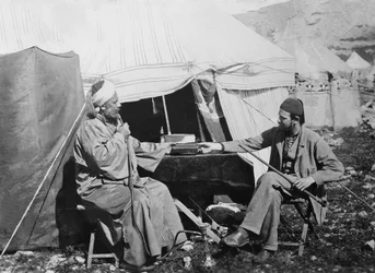 Yakub es Shellaby, presenting Captain C. Warren with a book of Samaritan prayers for the Archbishop of York, Samaria District, Palestine, 1867