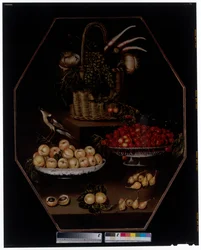 A Still Life with Pomegranates and Grapes in a Basket