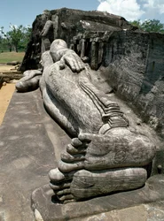 The reclining image, which depicts the Buddha