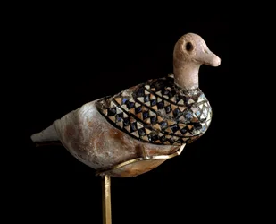 Duck shaped lamp made with a shell inlaid with lapis lazuli, red limestone and mother of pearl. 3000 BC. Baghdad, National Iraq Museum