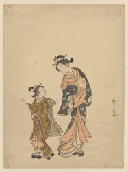 Young woman and girl with snowball