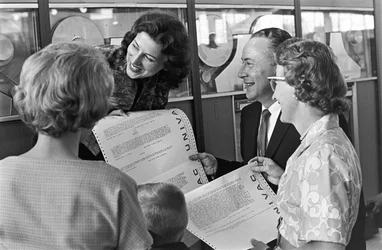 Holding printouts from a UNIVAC computer, the Vic Pakka family of Denver visits the Seattle World