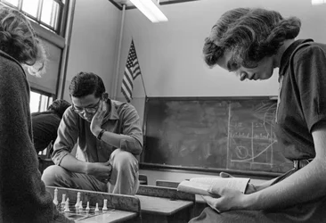 Students playing chess and reading at James A. Garfield High School, an urban public school