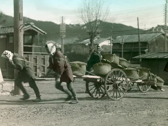 Japanese Peasants Pulling Sacks of Rice on a Cart, circa 1900 - 1915