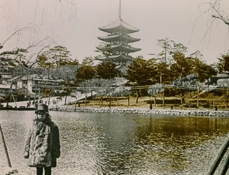 Portrait of a Young Japanese Man in Front of a Pagoda in Tokyo, circa 1900 - 1915