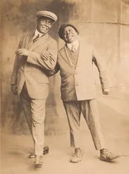 Photograph of two men linking arms, 1910s - 1920s